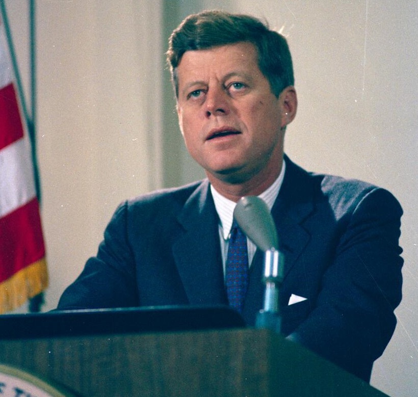 President John F. Kennedy delivers a radio and television address to the nation regarding the dismantling of Soviet missile bases in Cuba. Fish Room, White House, Washington, D.C Robert Knudsen. White House Photographs. John F. Kennedy Presidential Library and Museum, Boston (KN-C24801 public domain photo)
